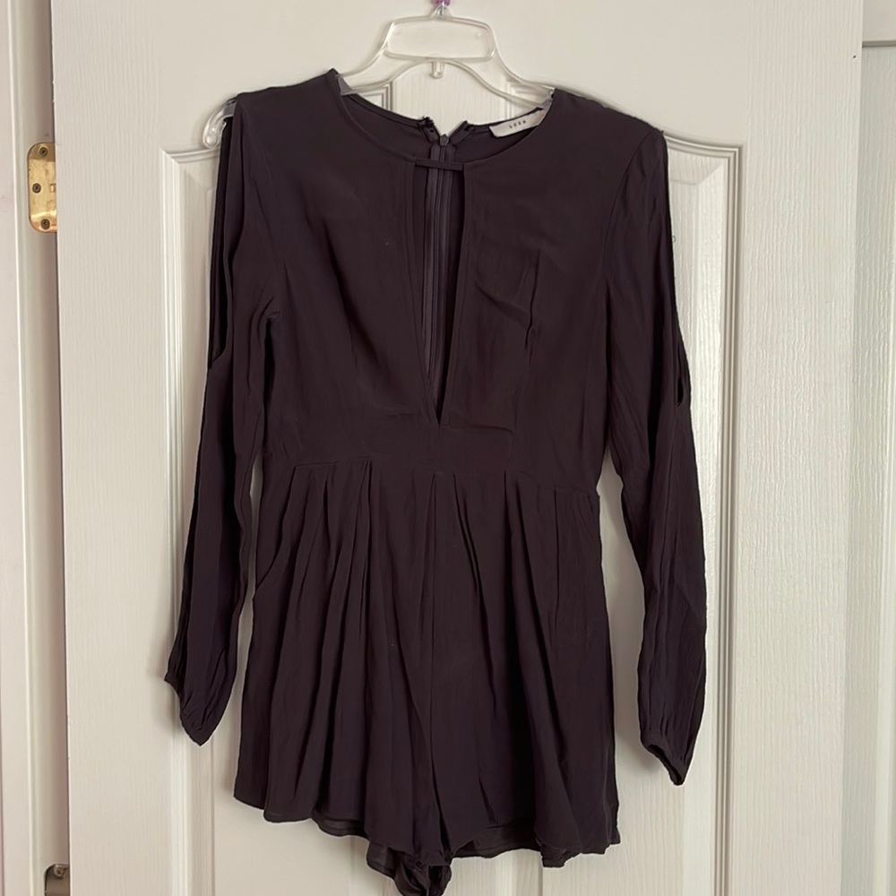 Dark Charcoal gray lush romper. Long sleeves but is open at the shoulders.